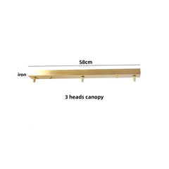 Gold iron with three heads and a measurement label on a white background