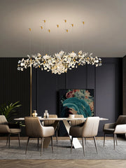 Modern dining room with a stylish chandelier, table, and chairs.