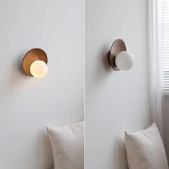 Split image showing the wood arc wall sconce with light on and off.