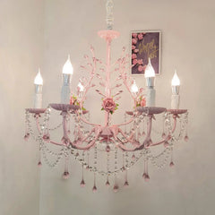 Close-up view of the pink floral chandelier, showing the intricate crystal details and rose embellishments.