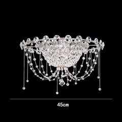 Decorative ceiling light fixture with crystal details on a black background