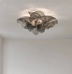 Ceiling light fixture with a modern design on a white ceiling