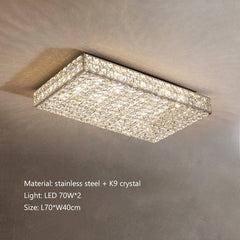 Square ceiling light fixture with crystal details on a neutral wall background