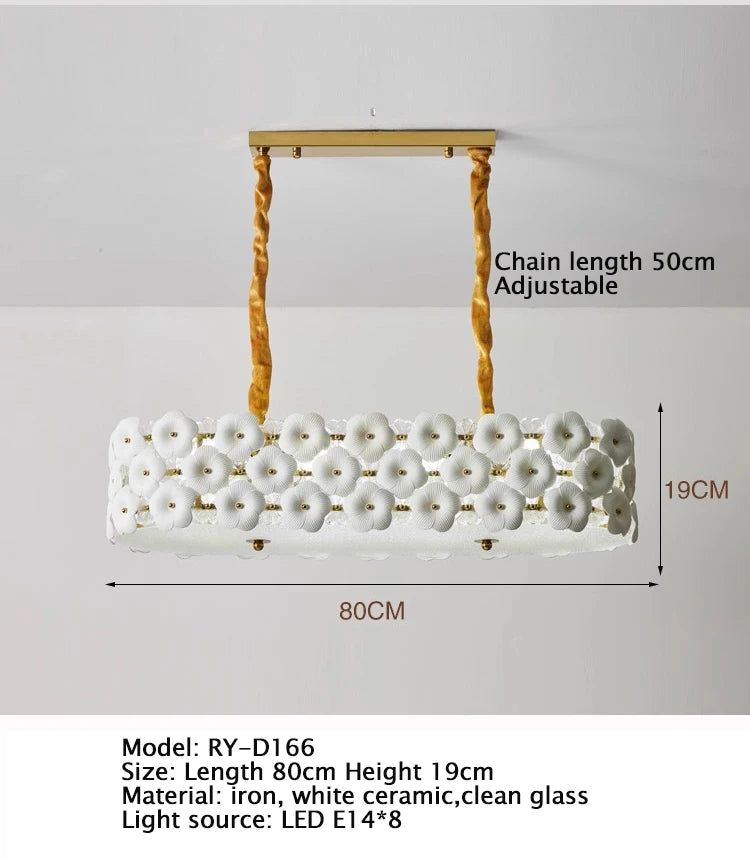 Chandelier with white ceramic design and gold chain on a gray background