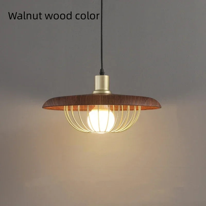 Wooden pendant light with a glowing bulb on a gray background