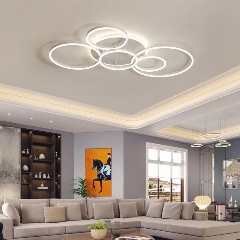 View of the gold interlocking ring flush mount light from a different angle in a bright room.