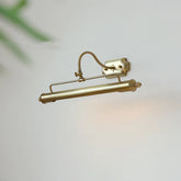 Brass wall-mounted light fixture on a white background