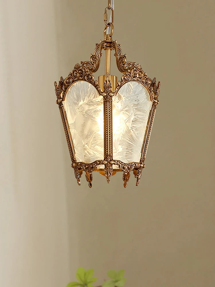 Decorative hanging lantern with glass panels on a plain background