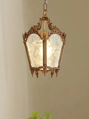 Decorative hanging lantern with glass panels on a plain background