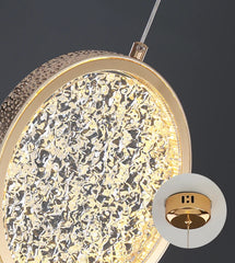 Close-up of a decorative ceiling light fixture with intricate design on a dark background