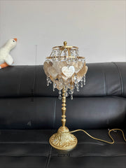 Decorative table lamp with crystal accents on a black sofa