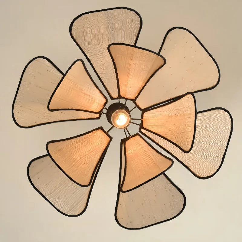 Ceiling light fixture with fan-like design on a beige background