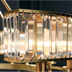 Close-up of a gold and crystal chandelier with blurred background