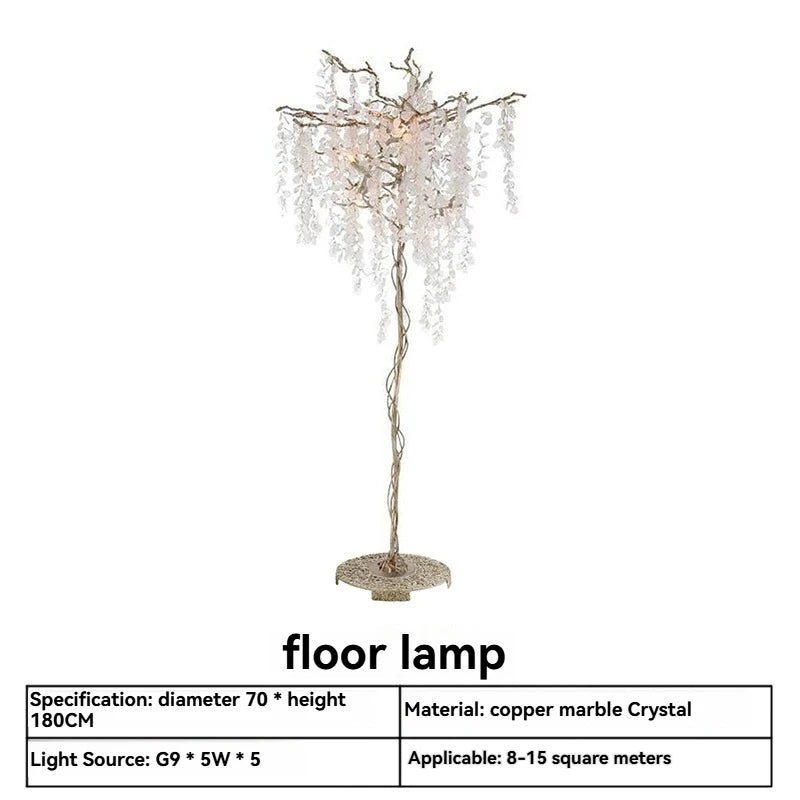 Decorative floor lamp with branches and crystals on a white background