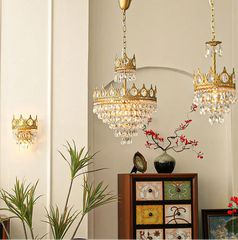 Decorative chandelier with crystal accents in a room setting.