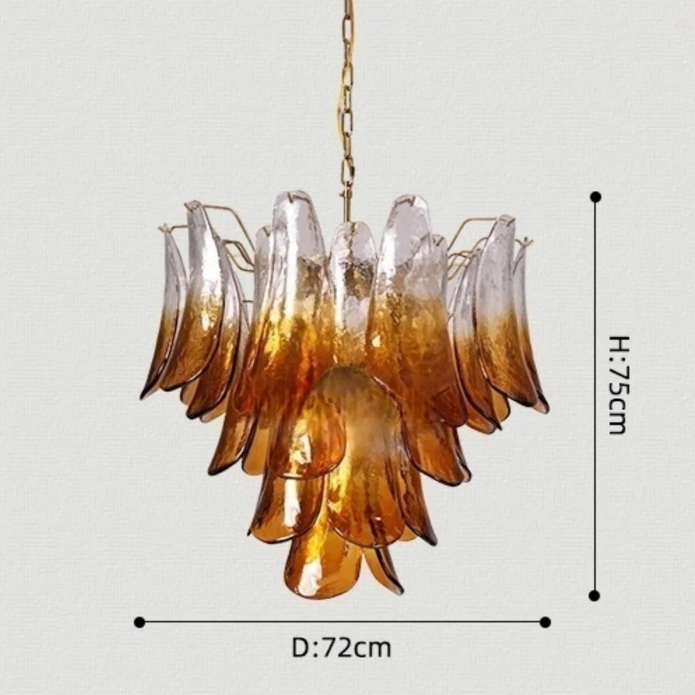 Chandelier with amber and clear glass shades on a light gray background