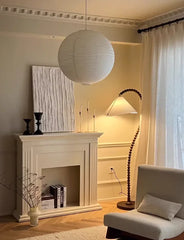 Living room with a fireplace, lamp, and sofa