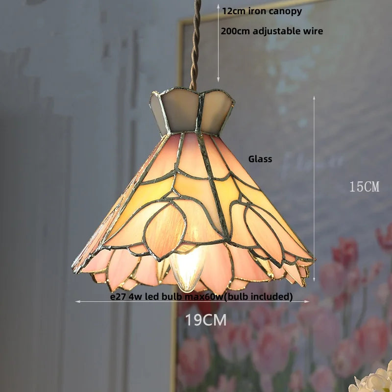 Stained glass pendant light with dimensions and bulb information on a floral background
