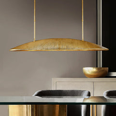 Close-up of the textured gold finish on the linear pendant light