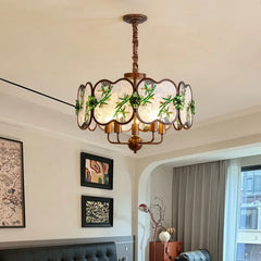 Bronze Chandelier with Frosted Glass and Green Leaf Floral Accents