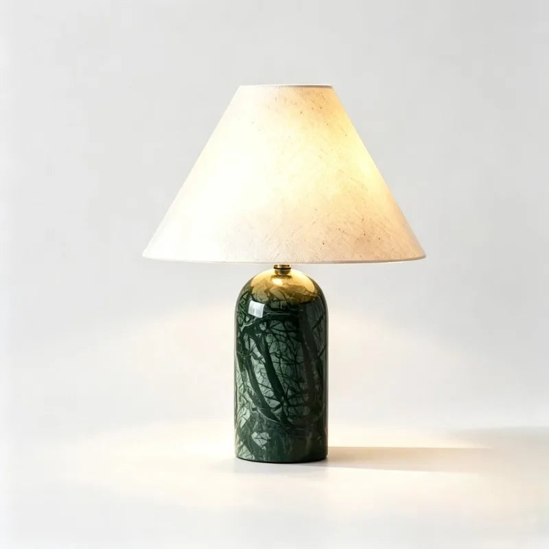 Green stone art ceramic table lamp with a conical fabric shade, shown on a white background.