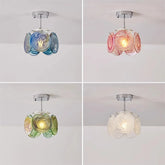 Chain-hung type floral glass pendant light in pink and white swirls, suspended by a chain.