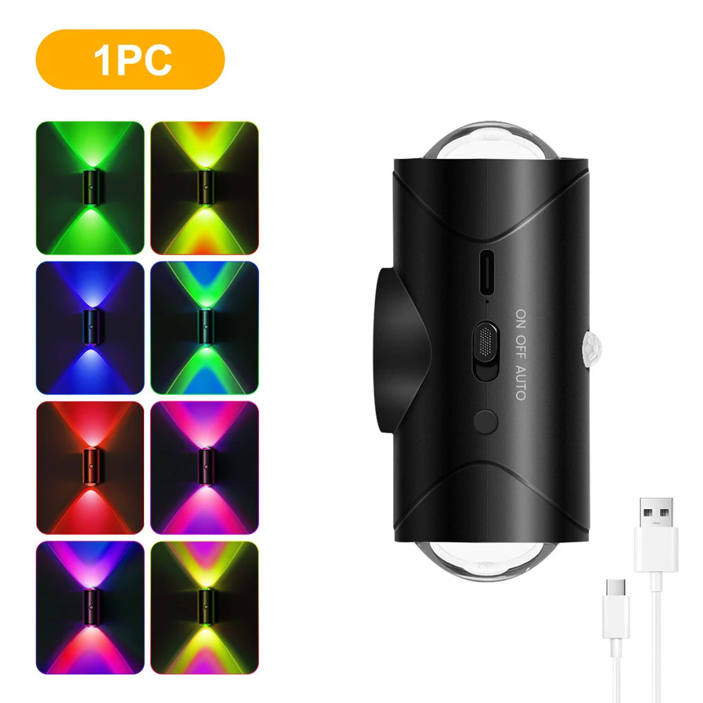 Black LED light device with colorful display and USB cable on a white background