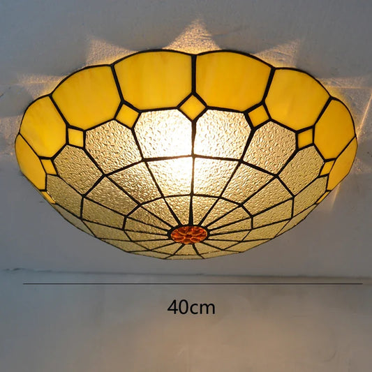 Close-up of a yellow stained glass ceiling light with a scalloped edge and a 40cm diameter indicated.