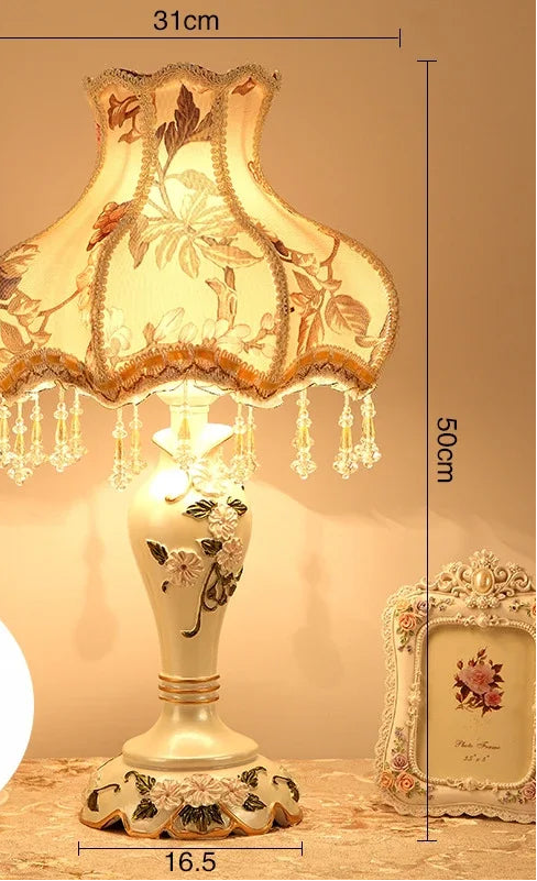 Decorative table lamp with floral design and measurements on a beige background