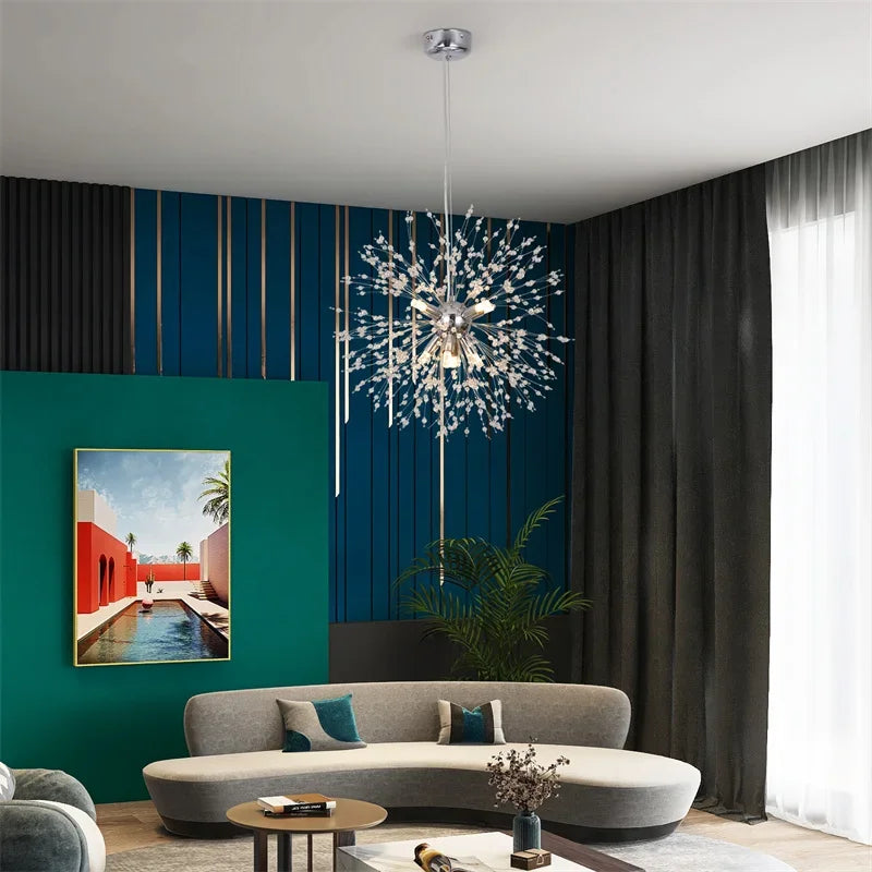 Modern living room with a chandelier, sofa, and decorative elements.