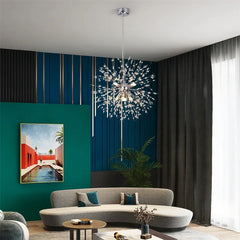 Modern living room with a chandelier, sofa, and decorative elements.