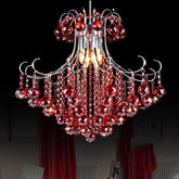 A cascading crystal chandelier with red crystals and a polished chrome frame against a black background.