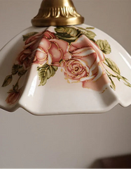 Decorative lampshade with floral design on a plain background