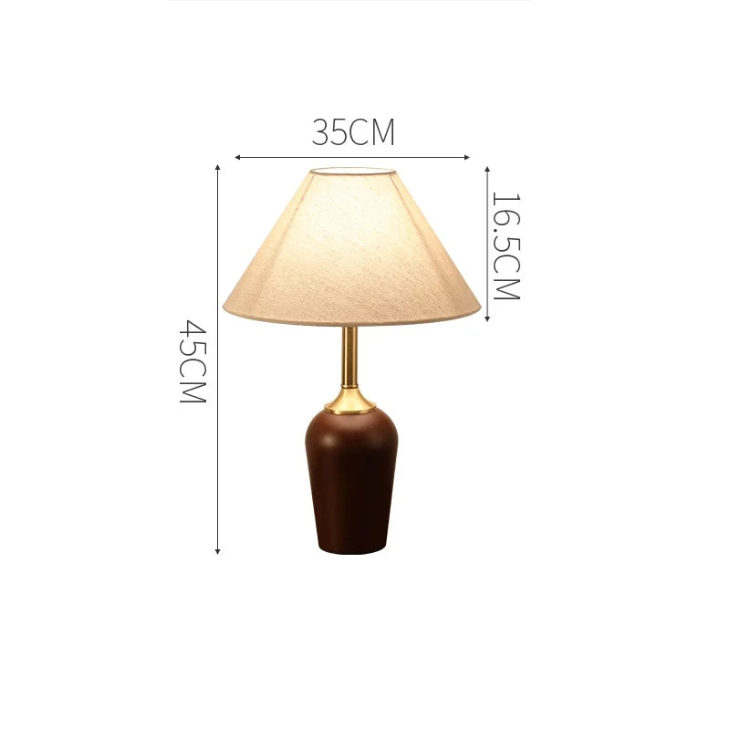 Table lamp with dimensions indicated on a white background