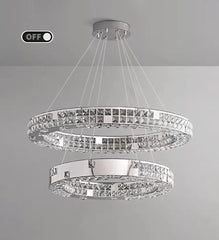 Chandelier with three circular tiers on a gray background