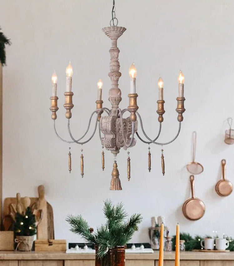 Wooden chandelier hanging in a kitchen with decorative elements.