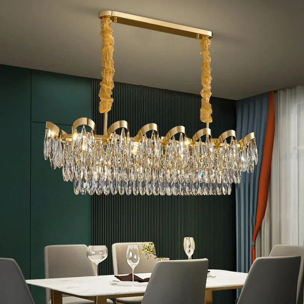 Close-up view of the gold cascading chandelier with teardrop crystals