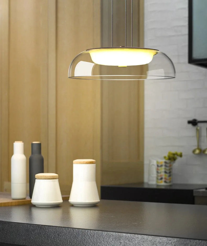 Modern table lamp on a kitchen counter with decorative items.
