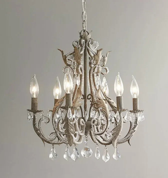 Decorative chandelier with crystal elements on a plain background