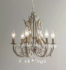 Decorative chandelier with crystal elements on a plain background