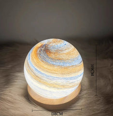 Decorative lamp with swirling design on a textured surface