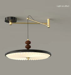 Modern wall-mounted lamp with adjustable arm on a gray background