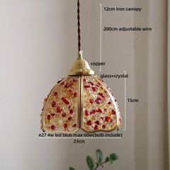 Decorative pendant light with measurements on a plain background