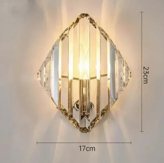Wall-mounted crystal light fixture with dimensions on a plain background