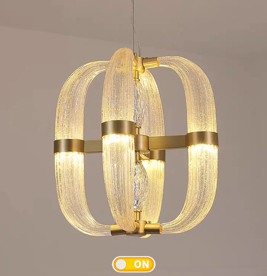 Modern chandelier with gold accents on a neutral background