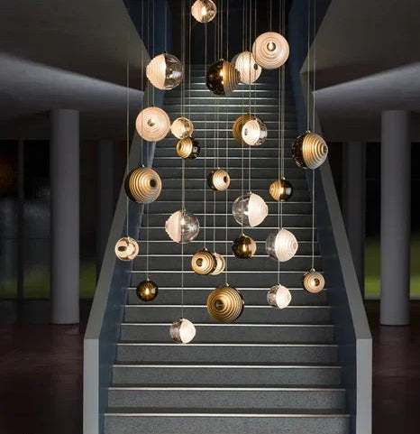 Modern chandelier with hanging lights on a staircase