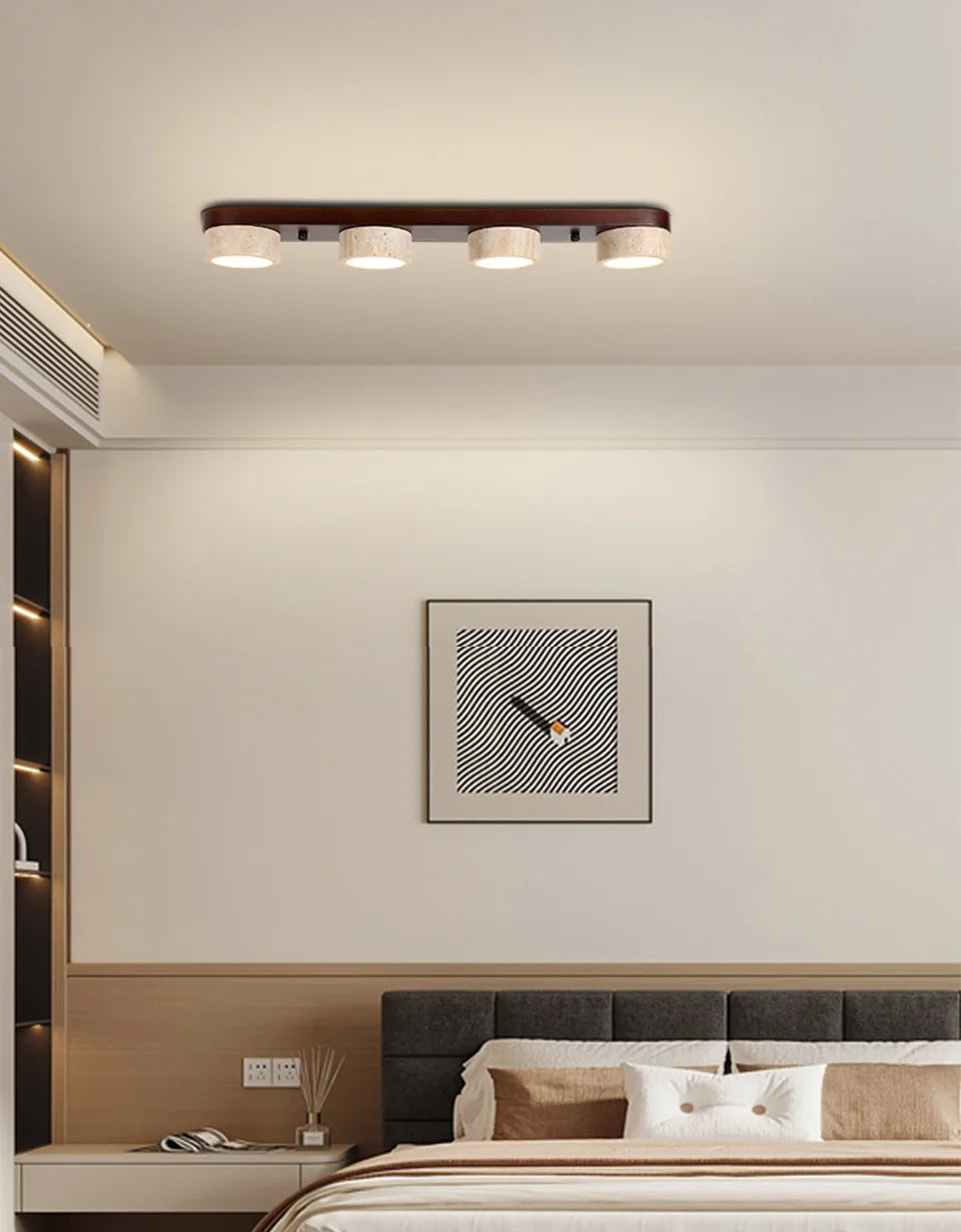 Modern bedroom with ceiling light fixture and wall art