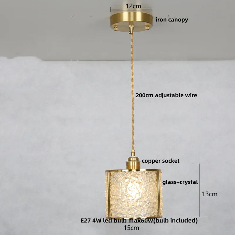 Gold pendant light with measurements on a white background