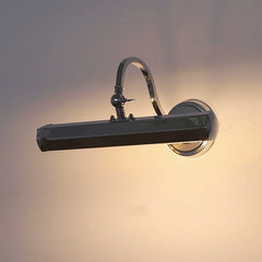 Modern wall-mounted light fixture with a dark finish on a neutral background