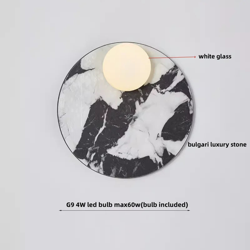 Decorative light fixture with white glass shade and Bulgari luxury stone base on a gray background.